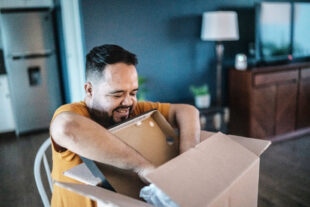 Man packing an object in a box